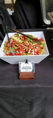 Santa Barbara Salad- raspberry walnut vinaigrette, strawberries, candied pecans, and gorgonzola cheese